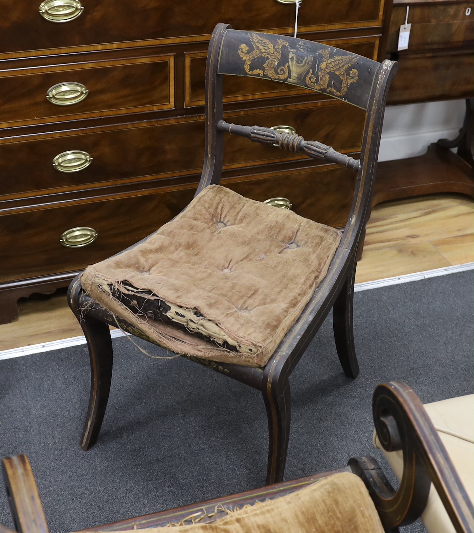A set of eight Regency painted cane seat dining chairs, two with arms (in need of restoration)